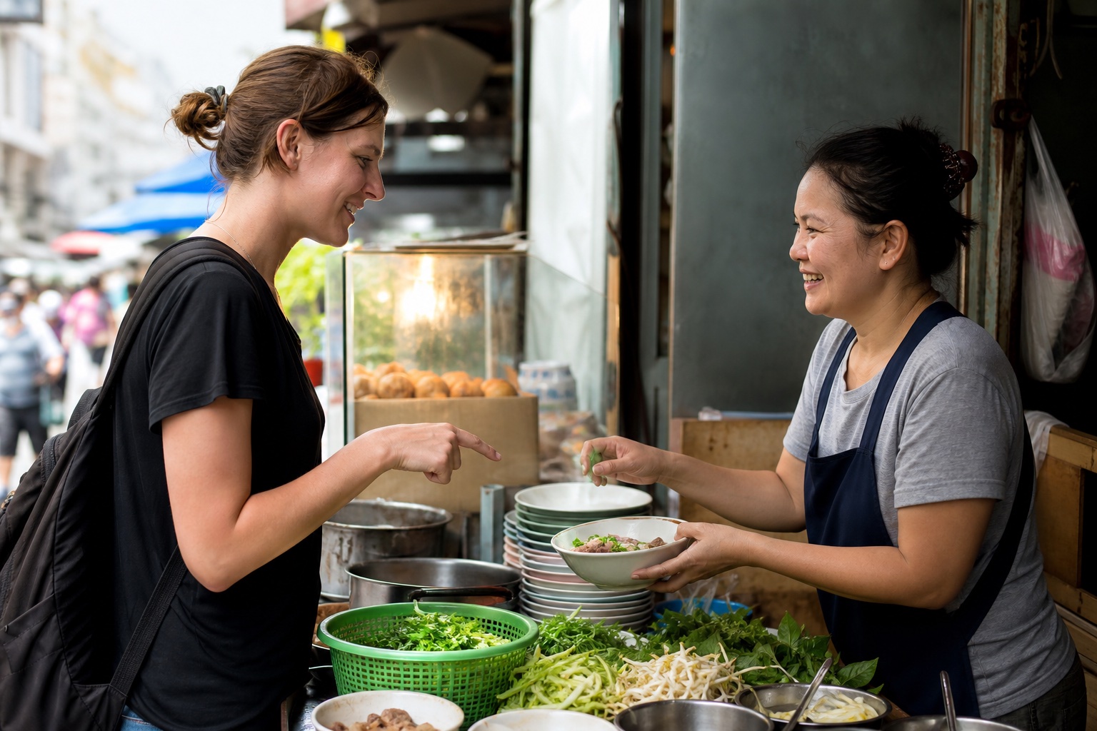 Visitor ordering a meal from a Bangkok street food vendor